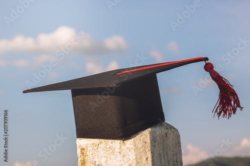 graduate hat and certificated in the garden photo