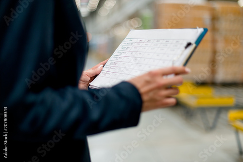 Female hands holding Inventory list