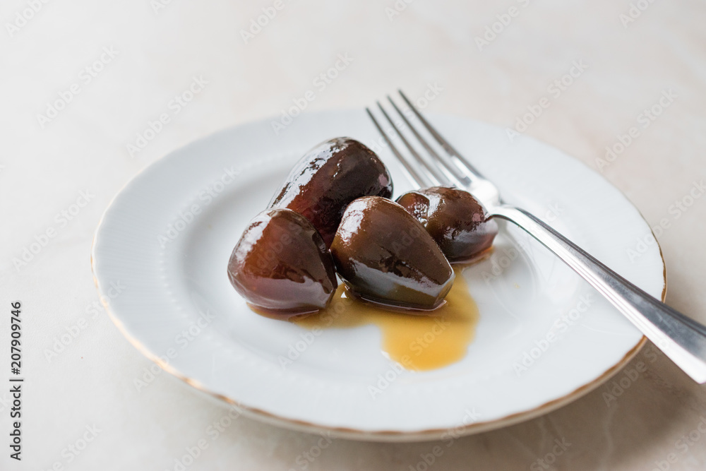 Turkish Style Crispy Fig Dessert served with Plate and Fork / Fruit Jam Dessert Turkish Style Crispy Fig Dessert served with Plate and Fork / Fruit Jam Dessert