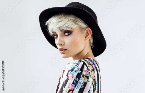 Beauty portrait of fashion blond model in a hat