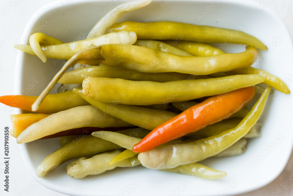 Pickled Green Pepper Pickles in Bowls. Pickled Green Pepper Pickles in Bowls.