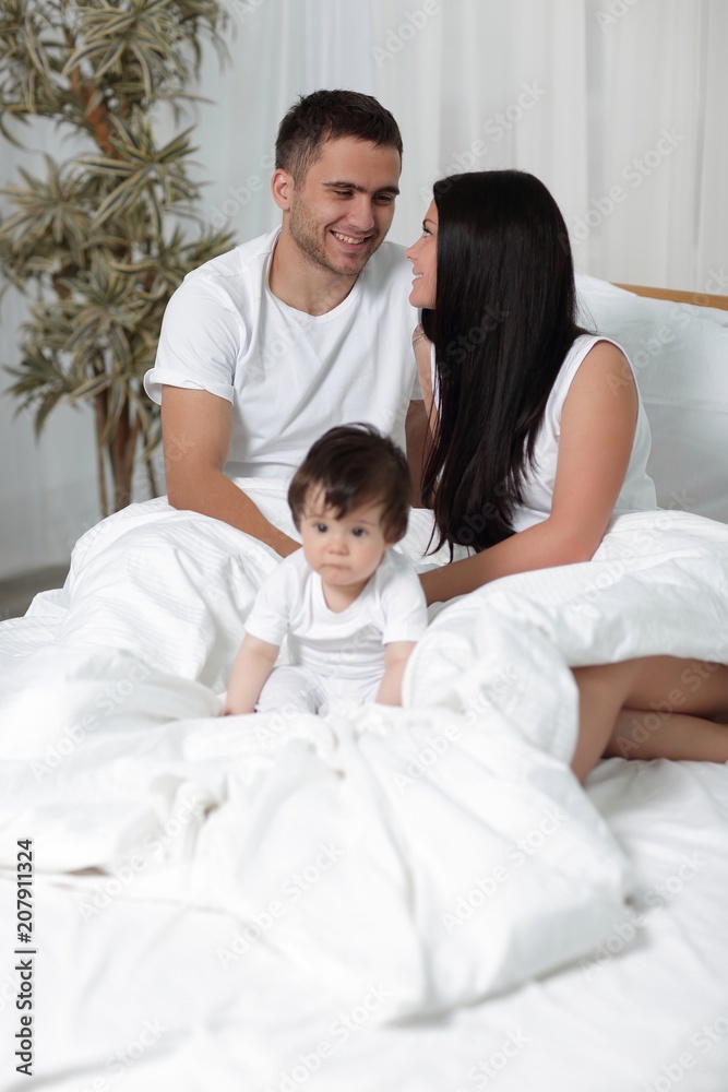 A happy young family from three persons A happy young family from three persons