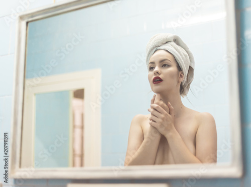 Nude woman  in bathroom