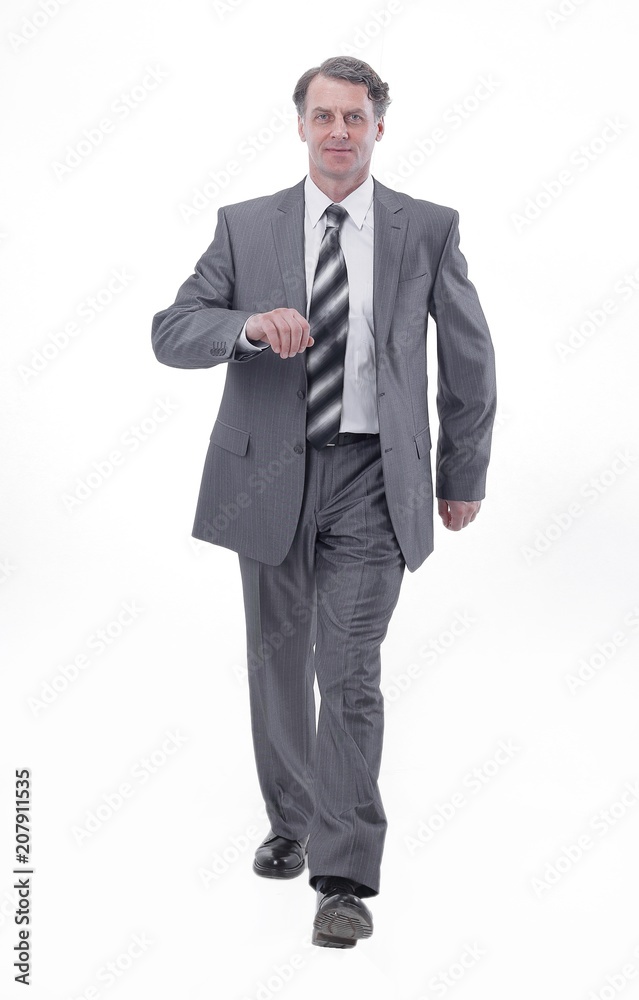 in all growth.a successful businessman, confidently striding forward. in all growth.a successful businessman, confidently striding forward.