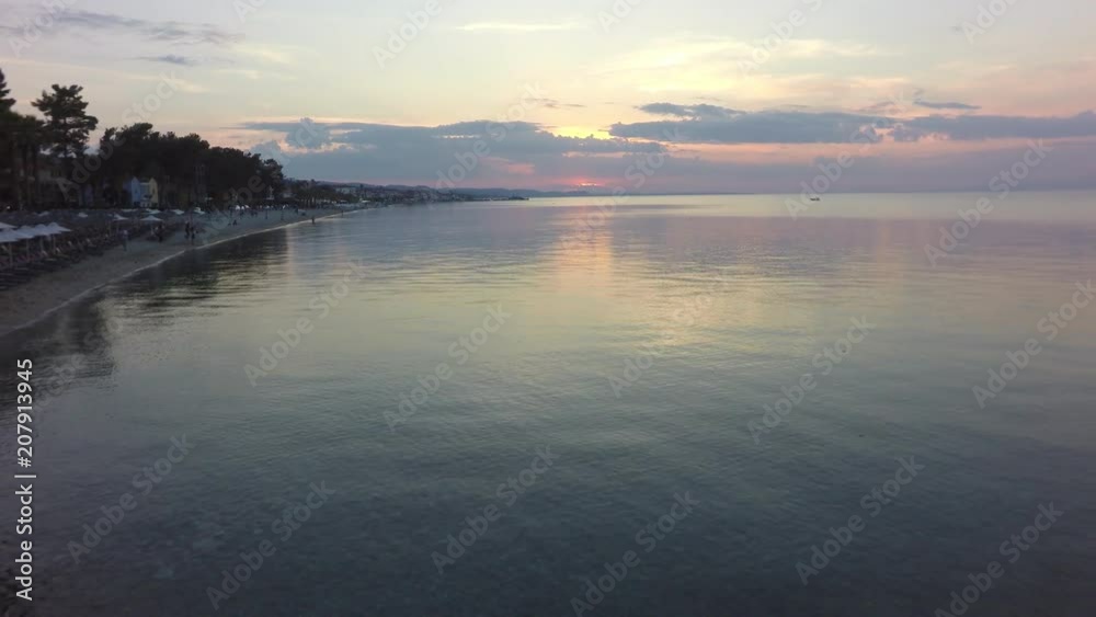 flight over the sea at sunset