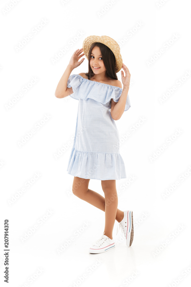 Full length image of Pleased young brunette girl in dress Full length image of Pleased young brunette girl in dress