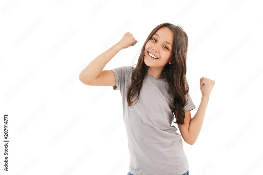 Cute girl standing isolated make winner gesture. Cute girl standing isolated make winner gesture.
