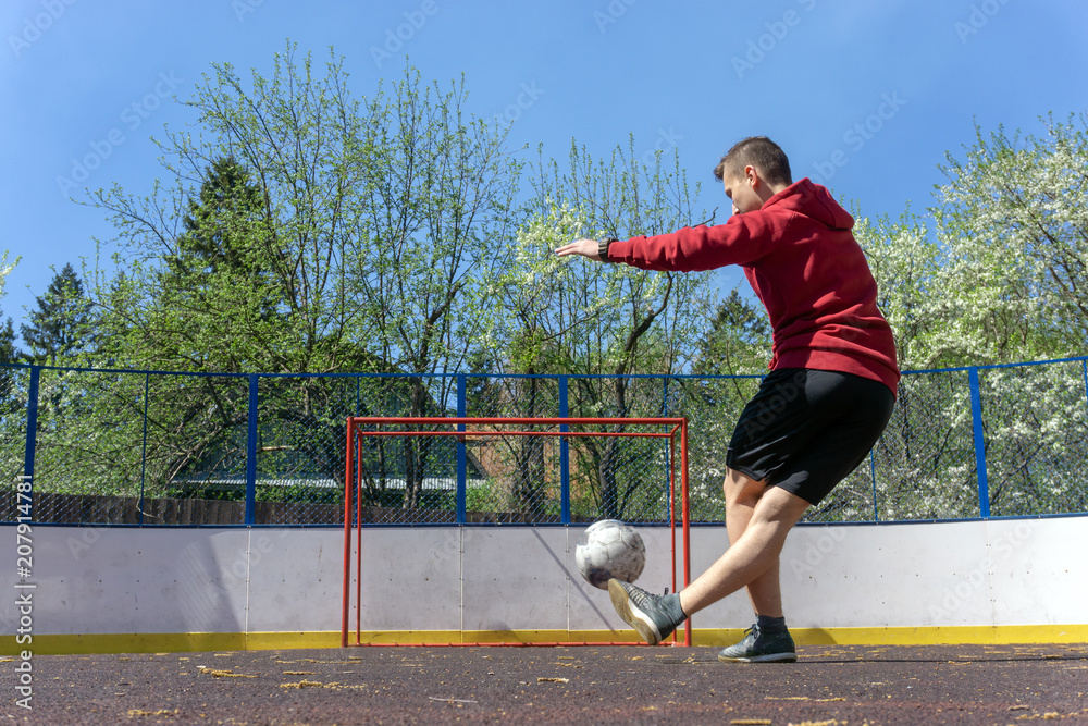 teenager playing football rabona