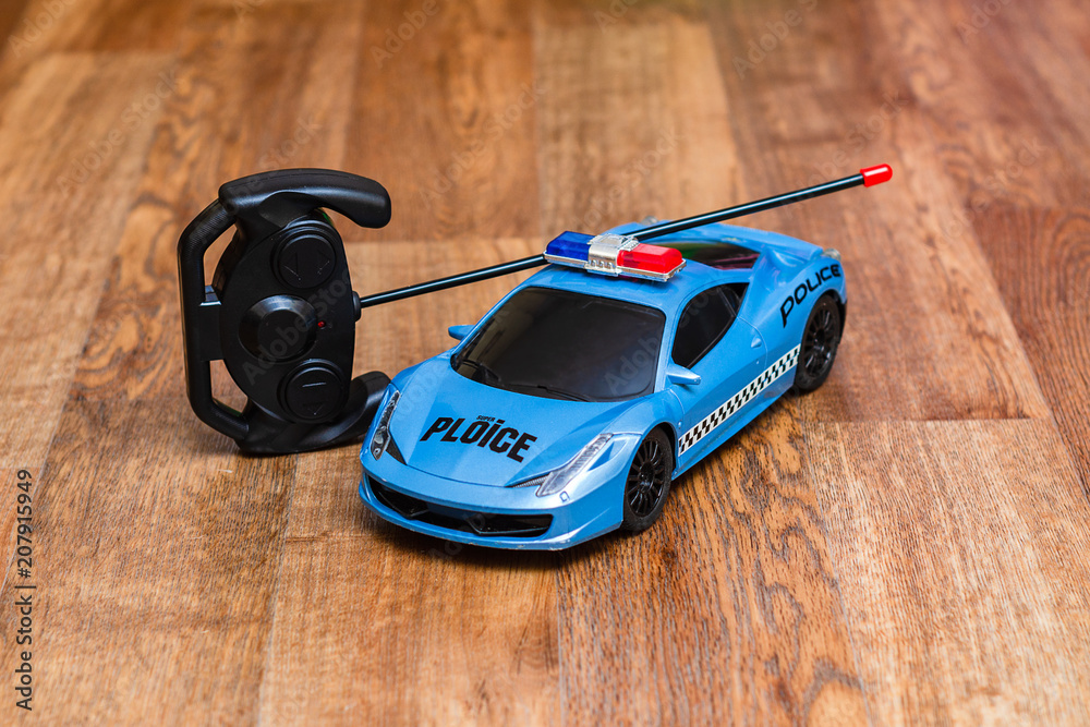 Fototapeta premium toy for children, police car on remote control