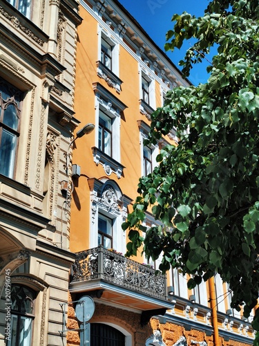 The facade of the historic old building with sculptures in St. Petersburg