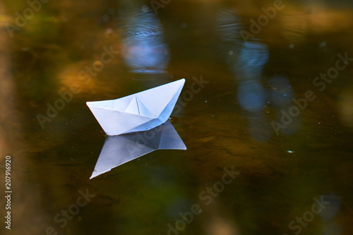 paper boat on the water