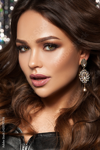 .fashin glamorous portrait of a girl, chic hairstyle, makeup and jewelry. Hollywood image.