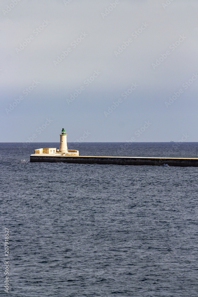 Seascape with St. Elmo Breakwater Lighthouse at Grand Harbor, Malta Seascape with St. Elmo Breakwater Lighthouse at Grand Harbor, Malta