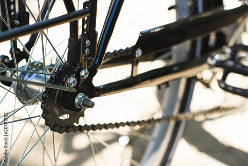 close-up view of bicycle wheel and chain, selective focus