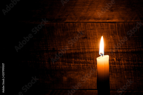candle on old wooden background