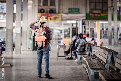 Bus station with young man are enjoying traveling. © Chayanin Wongpracha