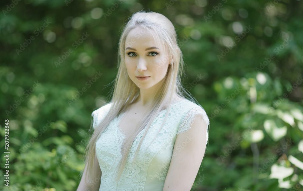 Summertime portrait of young woman in the park. Summertime portrait of young woman in the park.