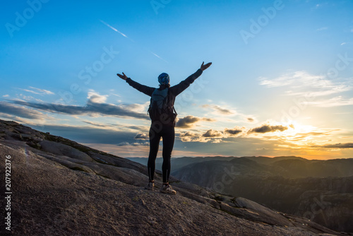 Woman successful hiking silhouette in mountains, motivation and inspiration in sunset © Kotangens