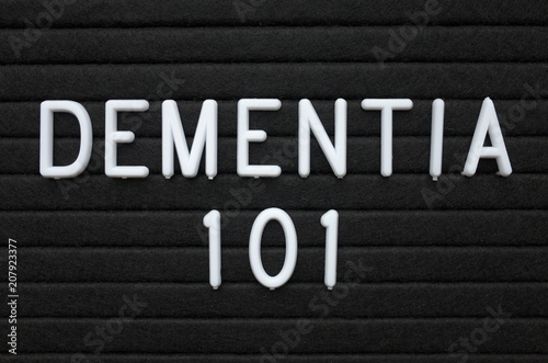 The words Dementia 101 in white plastic letters on a black letter board as an introduction to mental health issues
