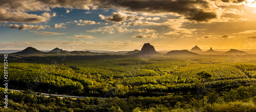 Panoramic view of Glass House Mountains at sunset visible from Wild Horse Mountain