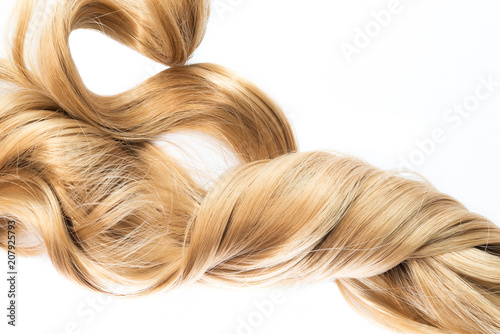 long blond wavy twisted hair isolated on white background