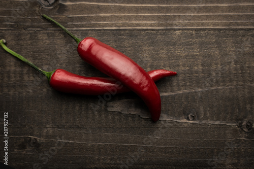 Chili Peppers on Dark Wooden Background