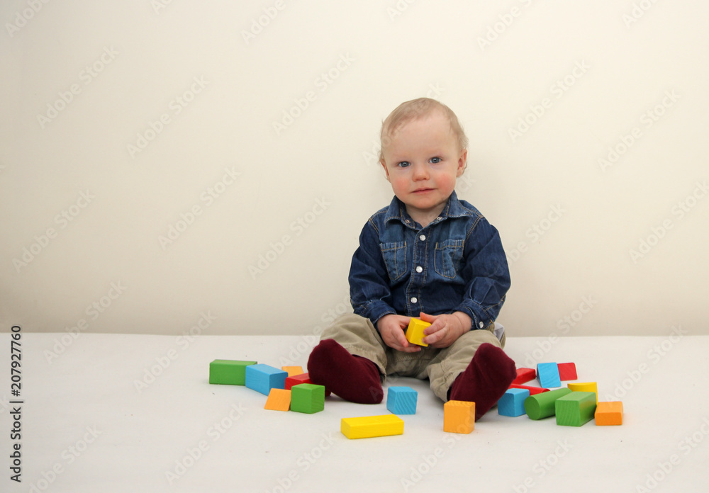 Little boy playing wooden colorful blocks Little boy playing wooden colorful blocks