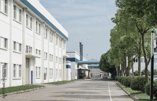 Factory building in the suburbs, industrial plant background