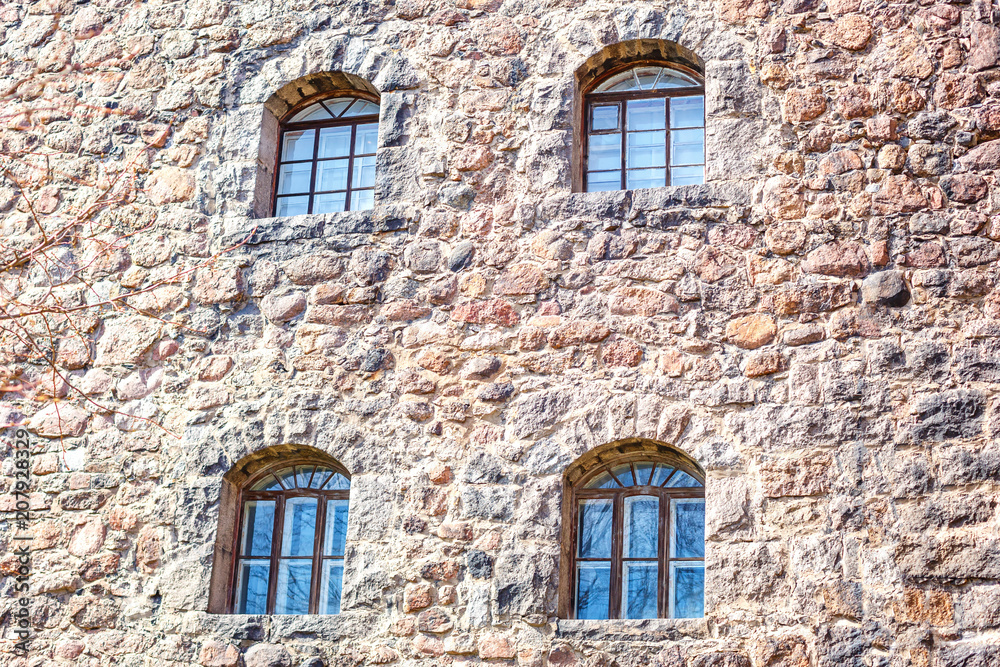 old arched Windows in the stone castle