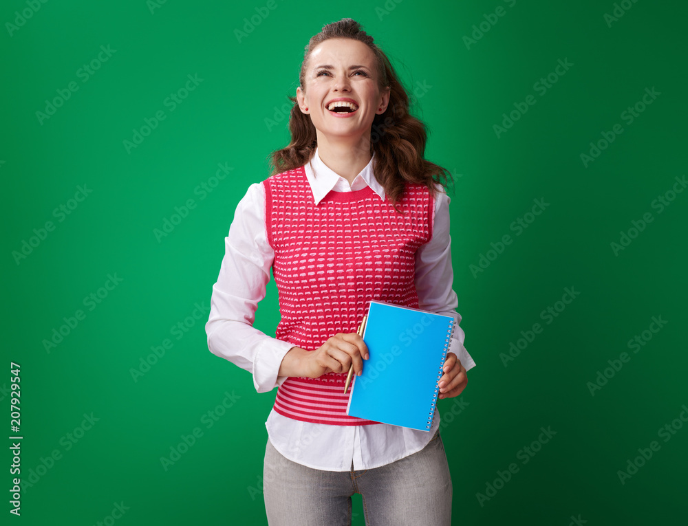 smiling student woman with blue notebook looking at copy space smiling student woman with blue notebook looking at copy space