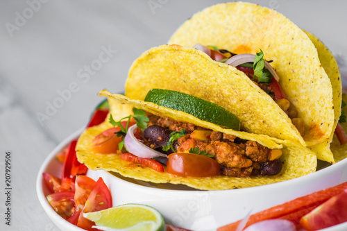 Colorful Mexican Tacos in Shells on Gray Background