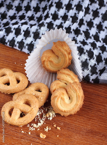 fresh sweet cookies on wooden in background