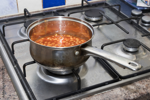 baked beans in a pan on a stove