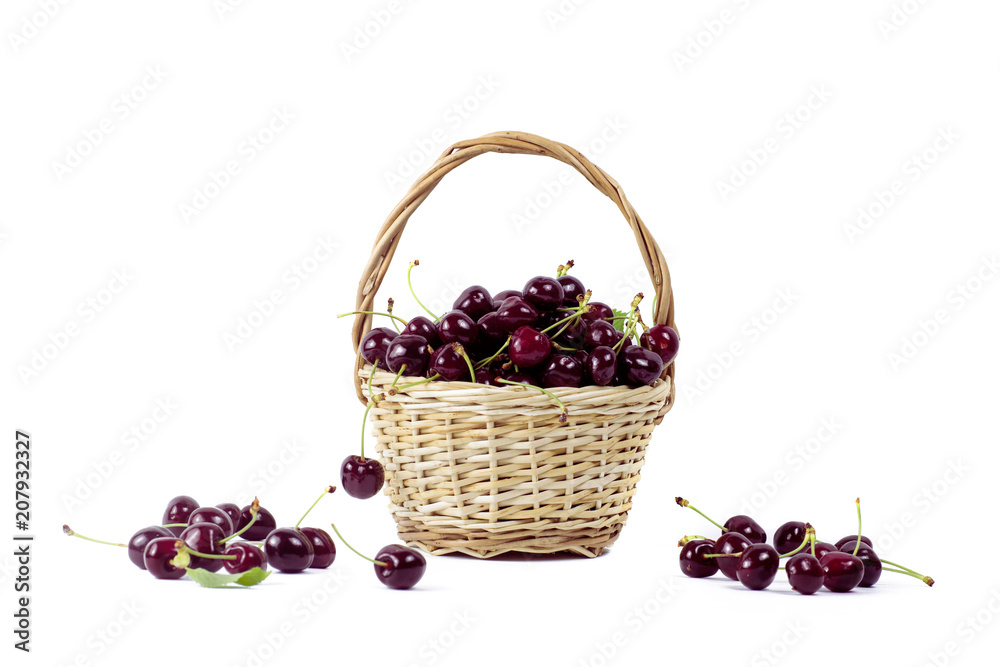 .A basket with black cherry on an isolated background. .A basket with black cherry on an isolated background.