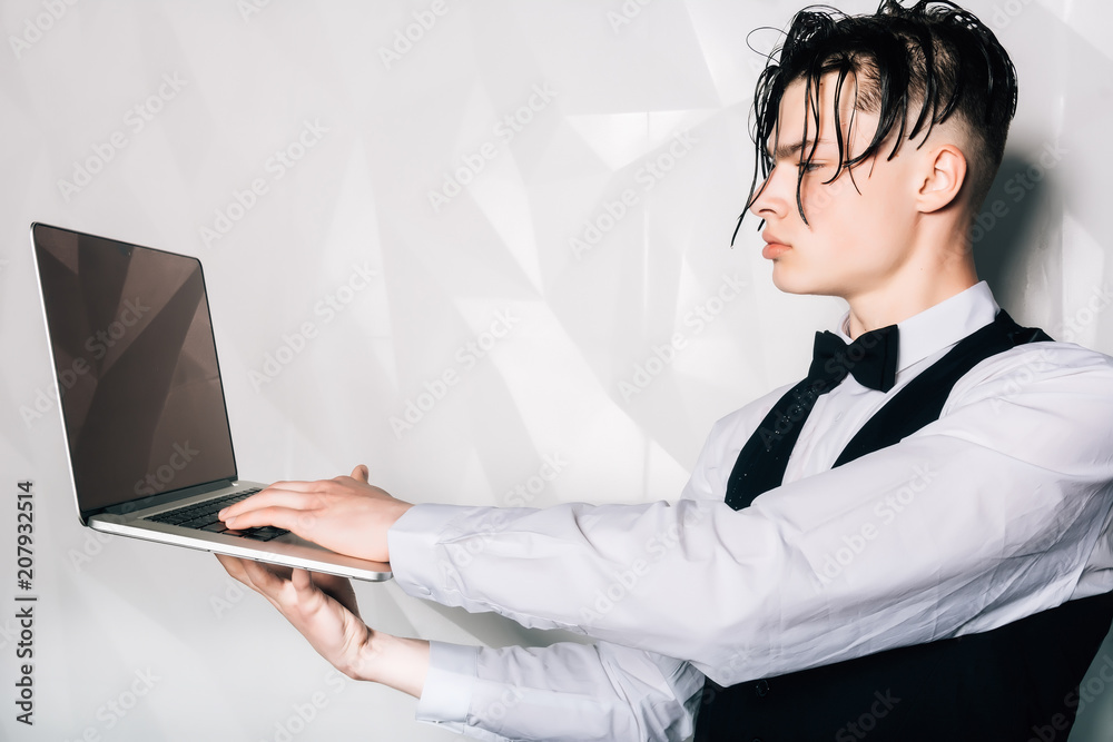 Man with wet hair.Businessman with a laptop in his hands Man with wet hair.Businessman with a laptop in his hands