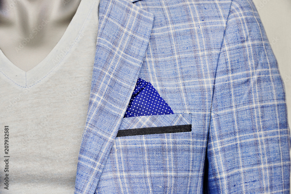 Blue napkin in a pocket of a stylishmale jacket