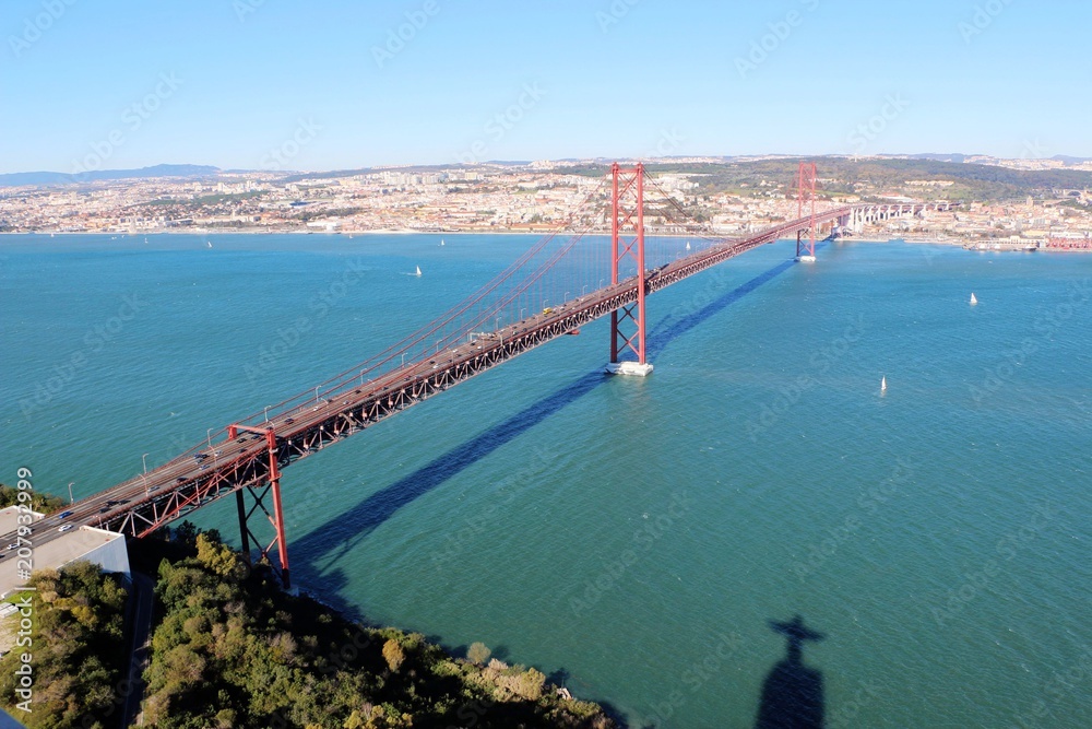 25 de Abril Bridge over the Tagus river, connecting Almada and Lisbon in Portugal