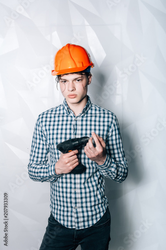 Master-Builder in their working clothes, with drill in his hands