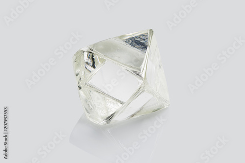 Transparent rough diamond isolated on white background