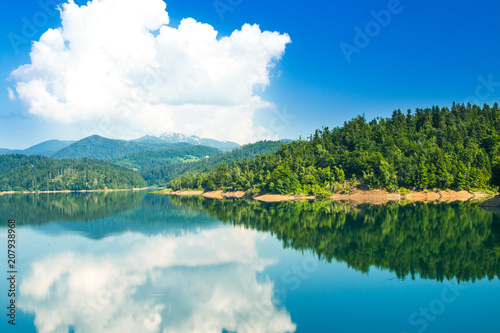 Fototapeta Naklejka Na Ścianę i Meble -  Croatian mountain landscape, region Gorski kotar, Lokvarsko lake with Risnjak mountain in background, reflection in watter