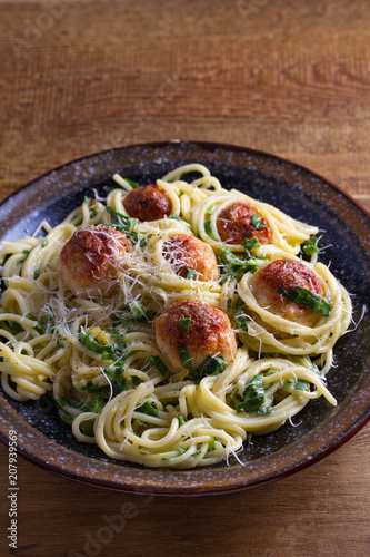 Spaghetti with spinach and chicken meatballs. Pasta with meatballs