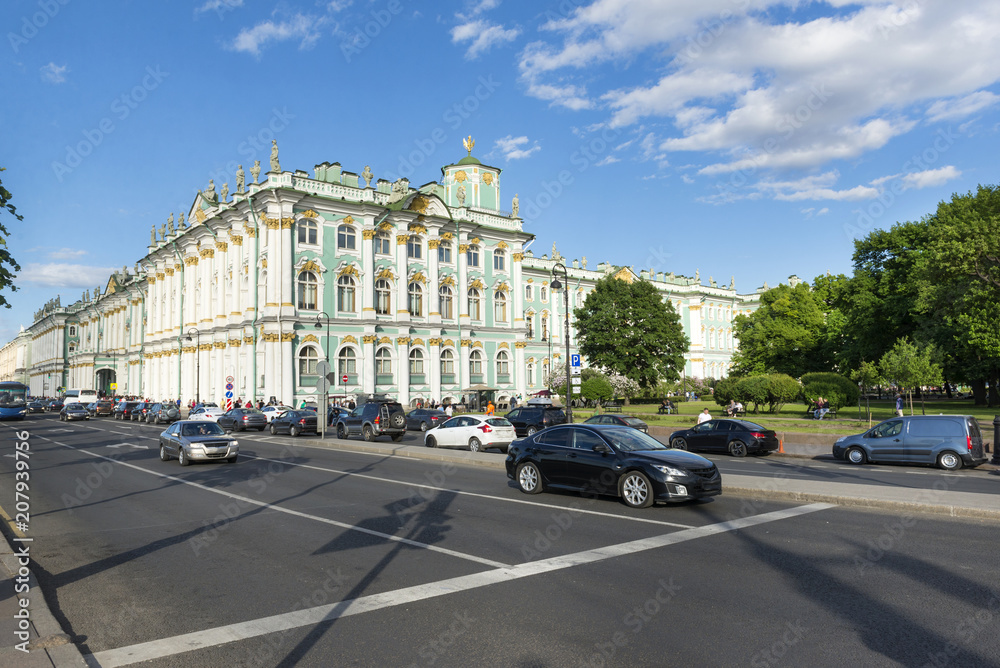 winter Palace in St. Petersburg, the cars are going along the Palace embankment by the winter Palace