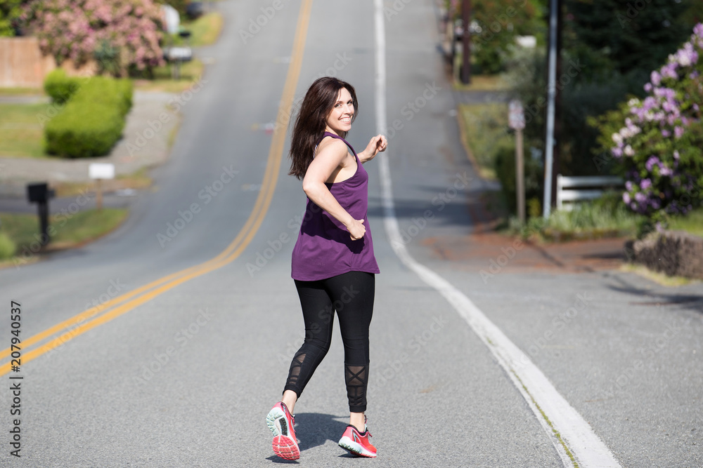 Pretty woman running down hill Pretty woman running down hill