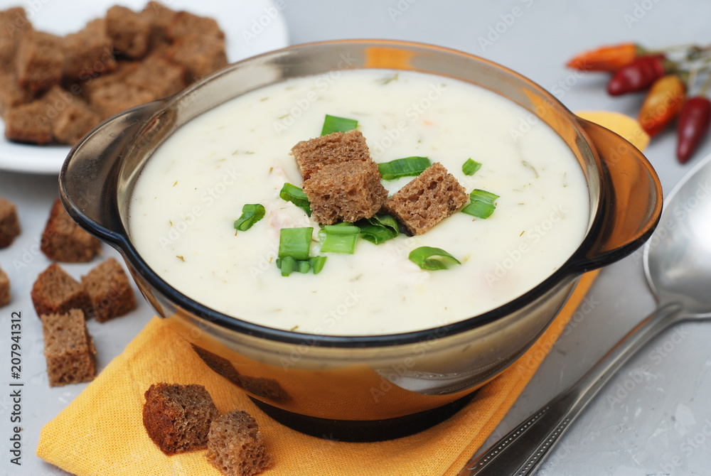 Cream Soup with Chicken Meat and Bread Crackers Croutons Orange Napkin Gray Textured Background Cream Soup with Chicken Meat and Bread Crackers Croutons Orange Napkin Gray Textured Background