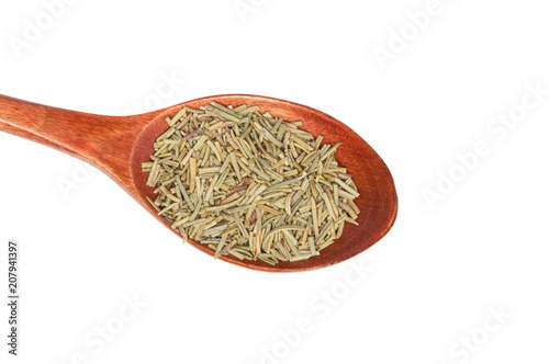 Dried rosemary spice in wooden spoon isolated on the white