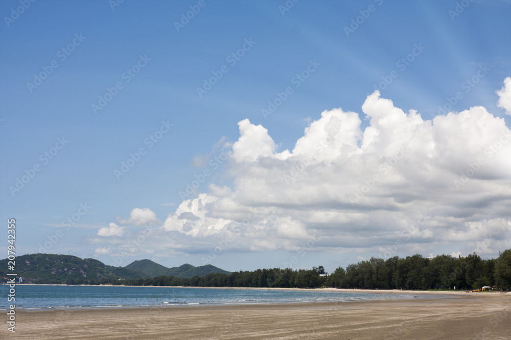 Sea view from tropical beach with sunny blue sky
