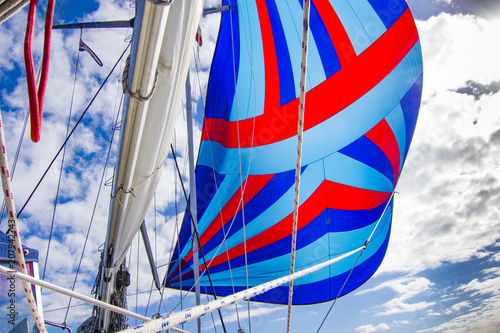 Flying a colorful spinnaker...