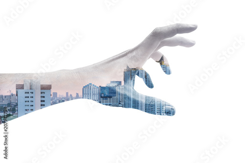 Double exposure hand reaching out and city view