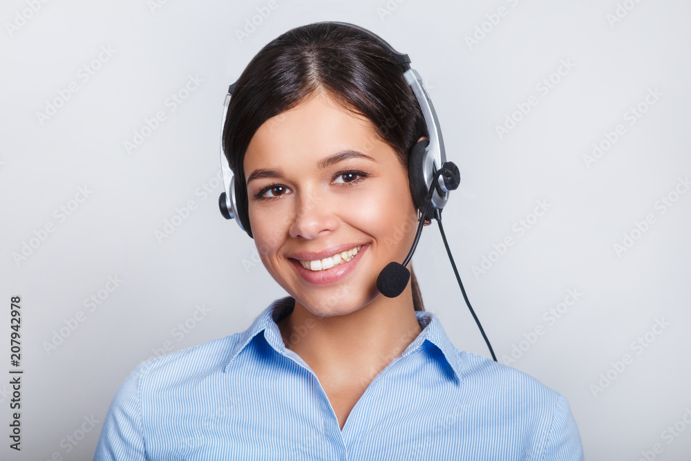 customer support phone operator in headset, with blank copyspace area for slogan or text message, over grey background. Consulting and assistance service call center. customer support phone operator in headset, with blank copyspace area for slogan or text message, over grey background. Consulting and assistance service call center.