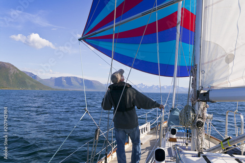 Flying a colorful spinnaker...